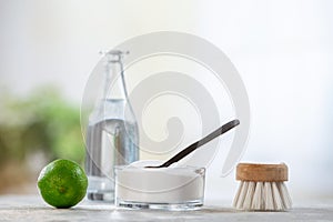 Natural cleaner. Vinegar, baking soda, salt, lemon.homemade grey wooden background