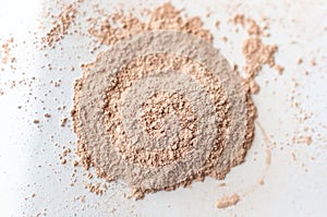 Natural colored pigment powder close up, matt eyeshadow or powder pigment on a white background