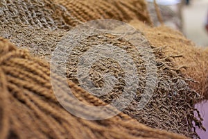 Natural Cord and Rough material. Rope detail, closeup. Horizontal. Brown tone. Copy space. Wallpaper and background