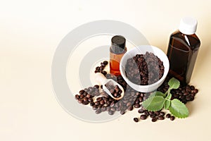 Natural cosmetic with coffee beans, sugar scrub, oil, shower gel, leaves of mint, scoop.