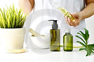 Natural cosmetic or skincare development in laboratory, Organic extract in cosmetic bottle container. photo