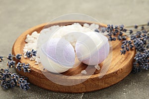 Natural cosmetics. Handmade lavender bath bombs and lavender flowers on wooden board