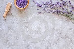 Natural cosmetics with lavender and herbs for homemade spa on stone background top view mock up