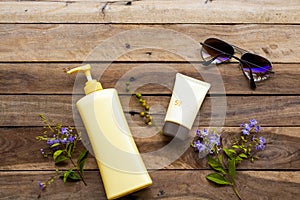 Natural cosmetics for skin face sunscreen spf50 ,body lotion ,sunglasses and purple flowers