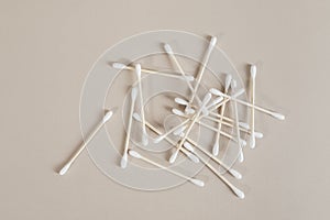 Natural cotton buds isolated on beige background