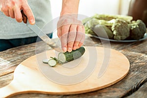 Natural cucumber being cutting.