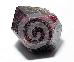 Natural dark red crystal of garnet-almandine mineral