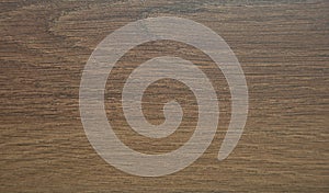 Natural dark walnut, wood texture on a cut closeup. Background. Close up shot