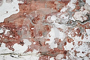 Natural destroyed stone surface. Vintage rustic pattern. Brown background. Old shabby cracked stucco. Dirty wall, grunge texture.