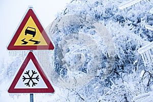 Natural disaster: dangerous and icy road with sleet covered trees