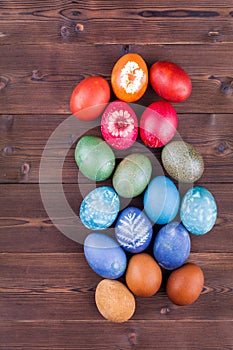 Natural dyed easter eggs on wood background