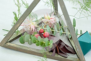 Natural Elegance: Geometric Centerpiece in Wedding Decor Featuring a Floral Arrangement with Eucalyptus, Blushing Bride, and Other