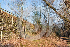 Natural engineering - soil bioengineering. Example of protection of a slope with natural material, wood and stones