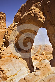 Erosive arch in hills from red sandstone photo