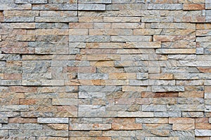 Natural facade stone decoration quartzite background texture. modern granite stone wall