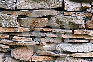 Natural facade stone decoration quartzite background texture. modern granite stone wall