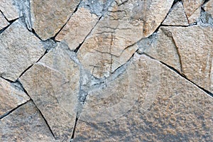 Natural facade stone decoration quartzite background texture. modern granite stone wall