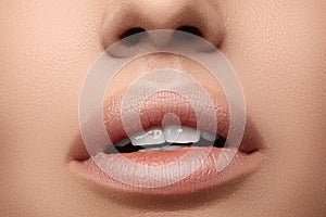 Natural fashion lipstick. Close-up beautiful lips. Full lips with lip makeup. Filler Injections, Plastic Surgery