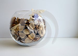 Natural flavoring for indoor. glass vase with mix of aromatic herbs, dried fruit and spices