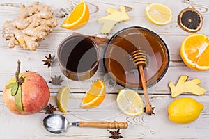 Natural flu and cold remedy - orange and lemon fruit, fresh ginger, honey.