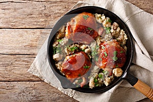 Natural Food: Baked chicken thighs with quinoa and mushrooms close up. horizontal top view