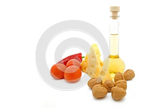 Natural form foods. Cheese, oil, nut and tomato.