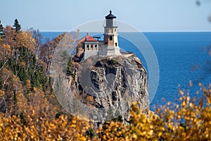 Natural framing of Split Rock Lighthouse on the North Shore of Minnesota, framed by fall leaves