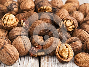 Natural fresh walnut on a vintage wooden background. Close-up. The concept of a healthy diet, natural antioxidants. Natural light