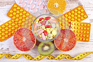 Natural fruits, centimeter and pills, slimming, choice between healthy nutrition and medical supplements