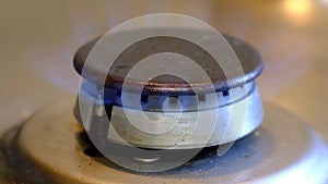 Natural gas burner ring on house cooking hob.