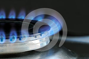 Natural gas burning on kitchen gas stove photo
