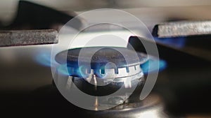 Natural gas burning in stove burner, close up view