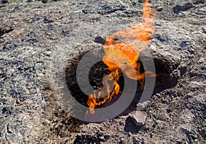 Natural gas burns a flam