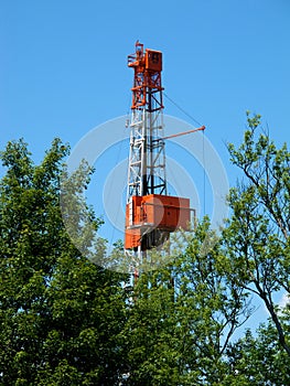 Natural Gas Drill Peaking Above Trees photo