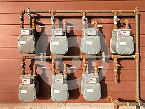 Natural gas meter bank on outside building wall