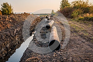 Natural gas pipeline construction. Laying a gas pipe in a green area