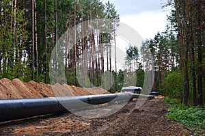 Natural gas pipeline construction work. A dug trench in the ground for the installation and installation of industrial gas