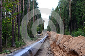 Natural gas pipeline construction work. A dug trench in the ground for the installation and installation of industrial gas