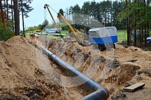 Natural gas pipeline construction work. A dug trench in the ground for the installation and installation of industrial gas and oil