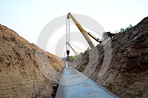 Natural gas pipeline construction work. A dug trench in the ground for the installation and installation of industrial gas and oil