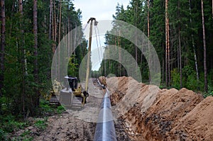 Natural gas pipeline construction work. A dug trench in the ground for the installation and installation of industrial gas and oil