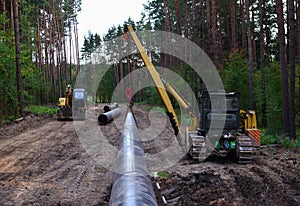 Natural gas pipeline construction work. A dug trench in the ground for the installation and installation of industrial gas and oil