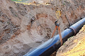 Natural gas pipeline construction work. A dug trench in the ground for the installation and installation of industrial gas and oil