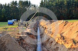 Natural gas pipeline construction work. A dug trench in the ground for the installation and installation of industrial gas and oil