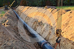 Natural gas pipeline construction work. A dug trench in the ground for the installation and installation of industrial gas and oil