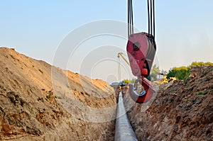 Natural gas pipeline construction work. A dug trench in the ground for the installation and installation of industrial gas and oil