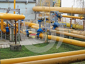 Natural gas station with yellow pipes power plant