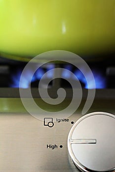 Natural gas stove dial, flame and pot