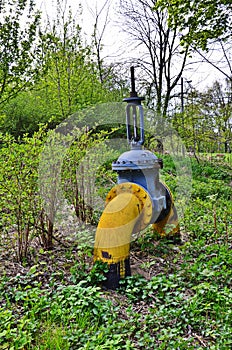 Natural gas valve painted in yellow color, closeup