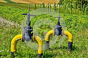 Natural gas valve painted in yellow color, closeup